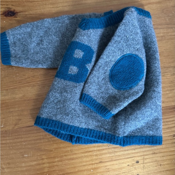 Bonpoint Baby Boy Merino Sweater w adorable shoulder patches and a mini v neck.